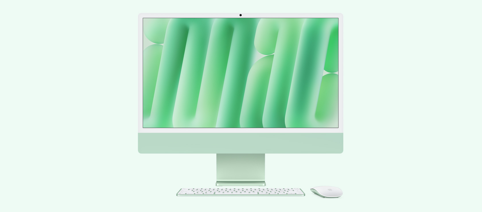 iMac vert vu de face avec souris et clavier assortis.